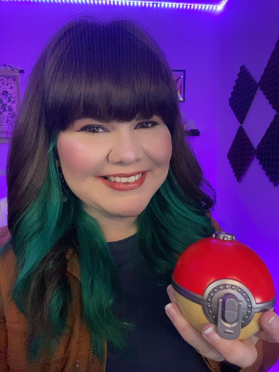 Mallory smiling and holding a Pokeball